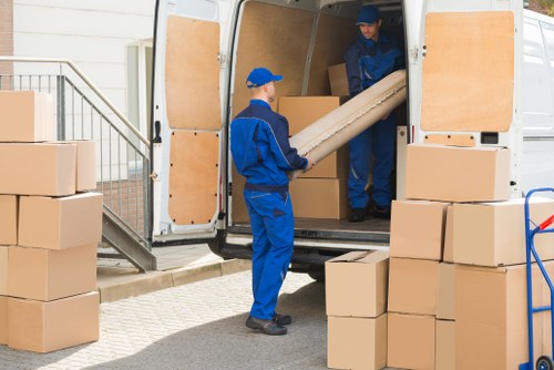 Removal team planning a home move in Holland Park near residential streets