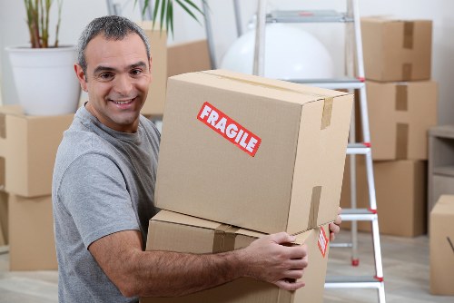 Removalists planning a house move in Holland Park residential street