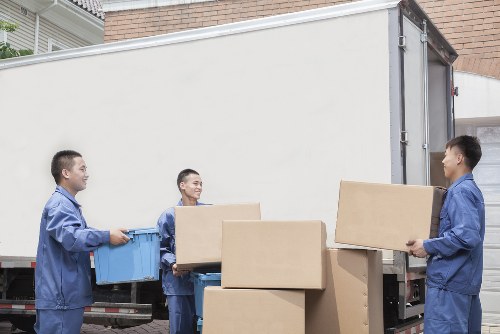 Man and van service loading items in Holland Park street