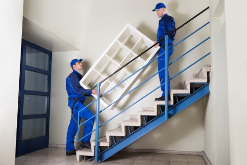 Team preparing furniture protection for a house move