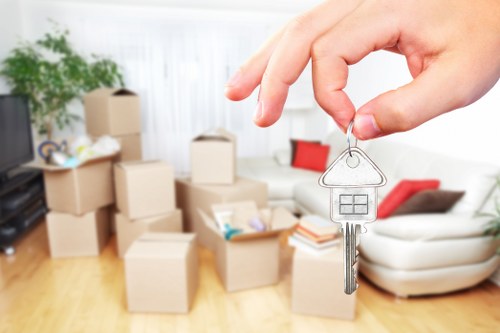 Professional moving team handling belongings with care in Holland Park