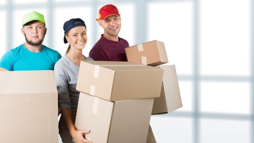 Packed boxes and household items ready for local transport in Holland Park