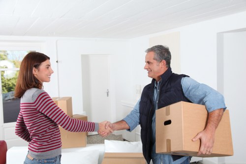 Packed boxes and furniture ready for loading in a local West London home