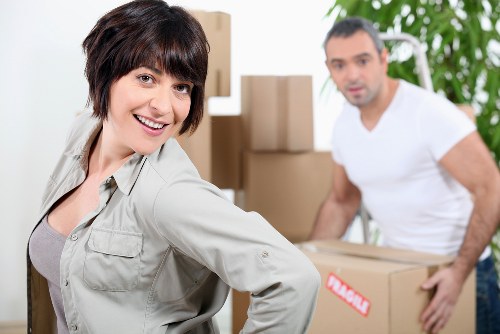 Careful unloading of household items for a move in Holland Park
