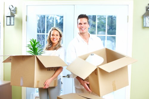 Packed moving boxes and furniture in a Holland Park home